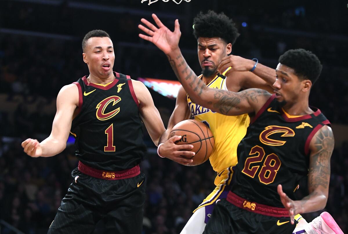 Lakers' Quinn Cook grabs a rebound from Cleveland Cavaliers' Dante Exum (1) and Alonzo McKinnie in the third quarter at the Staples Center on Monday.