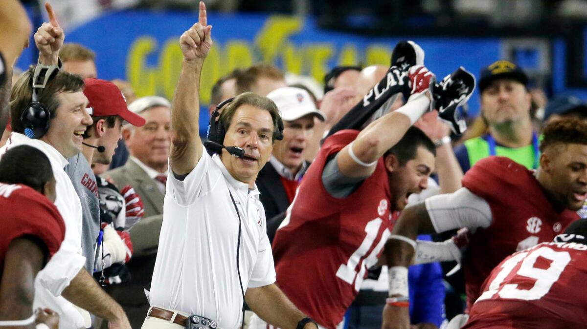 Alabama head coach Nick Saban and his team take the field at the end of the Cotton Bowl in Arlington, Texas on Dec. 31, 2015.