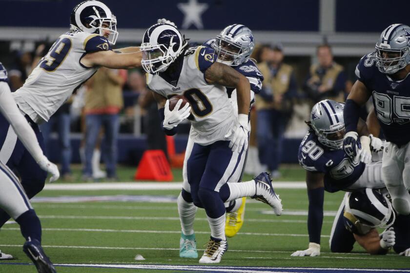 Los Angeles Rams running back Todd Gurley (30) carries for a short gain in the second half of an NFL football game against the Dallas Cowboys in Arlington, Texas, Sunday, Dec. 15, 2019. (AP Photo/Michael Ainsworth)