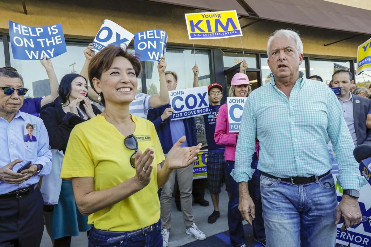 Republican congressional candidate Young Kim and gubernatorial candidate John Cox campaign in Rowland Heights.