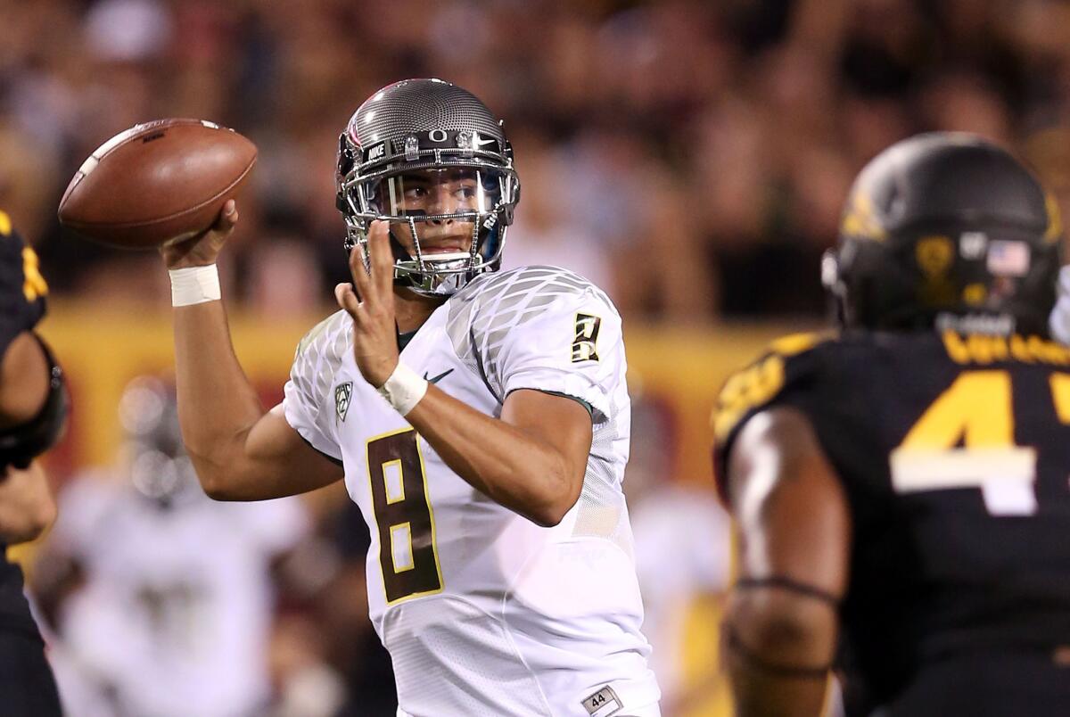Quarterback Marcus Mariota (8) led Oregon to a 43-7 lead in the first half at Arizona State on Thursday night.