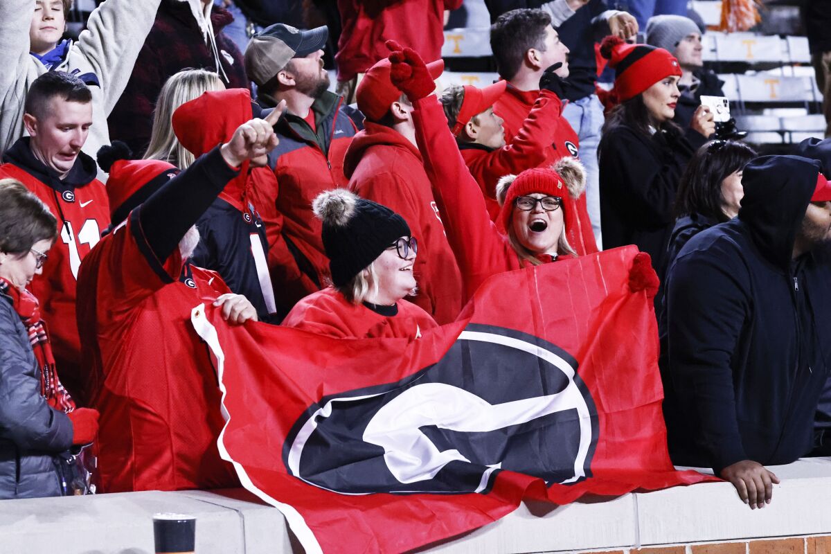 Georgia fans celebrate the Bulldogs' 41-17 win over Tennessee on Nov. 13, 2021, in Knoxville, Tenn. 