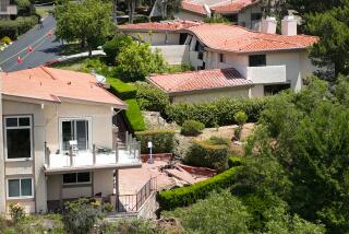 Rolling Hills Estates, CA, Sunday, July 9, 2023 - Cracked foundations and crumbled homes sit along a canyon on Peartree Lane, where dozens of residents were evacuated and structures condemned. (Robert Gauthier/Los Angeles Times)