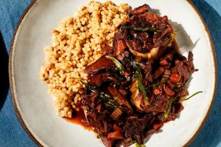 LOS ANGELES, CA - SEPTEMBER 8, 2022: Eggplant bourguignon and pearl couscous, prepared by cooking columnist Ben Mims on September 8, 2022 in the LA Times test kitchen. (Katrina Frederick / For The Times)