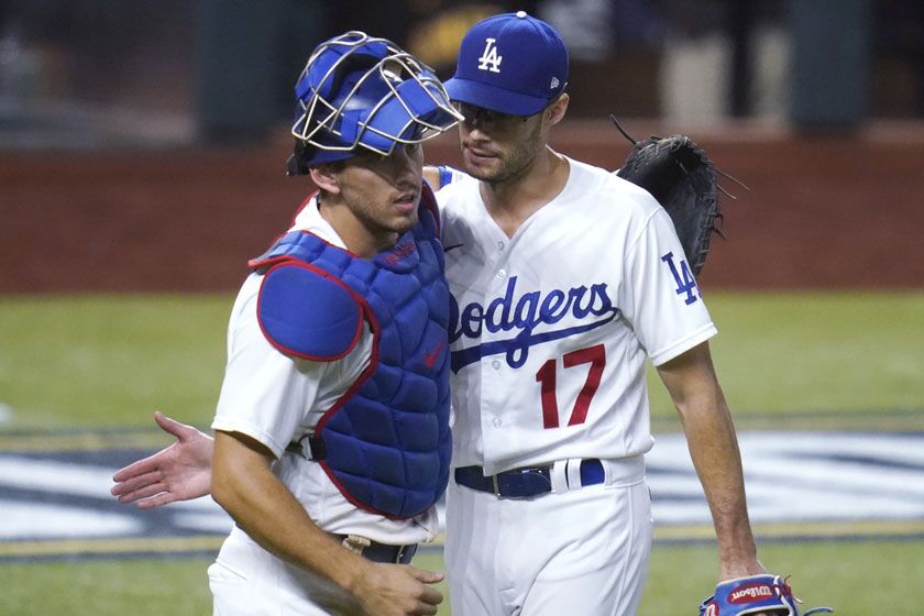 Dodgers closer Joe Kelly is congratulated by catcher Austin Barnes after earning the save in a win over the San Diego Padres.
