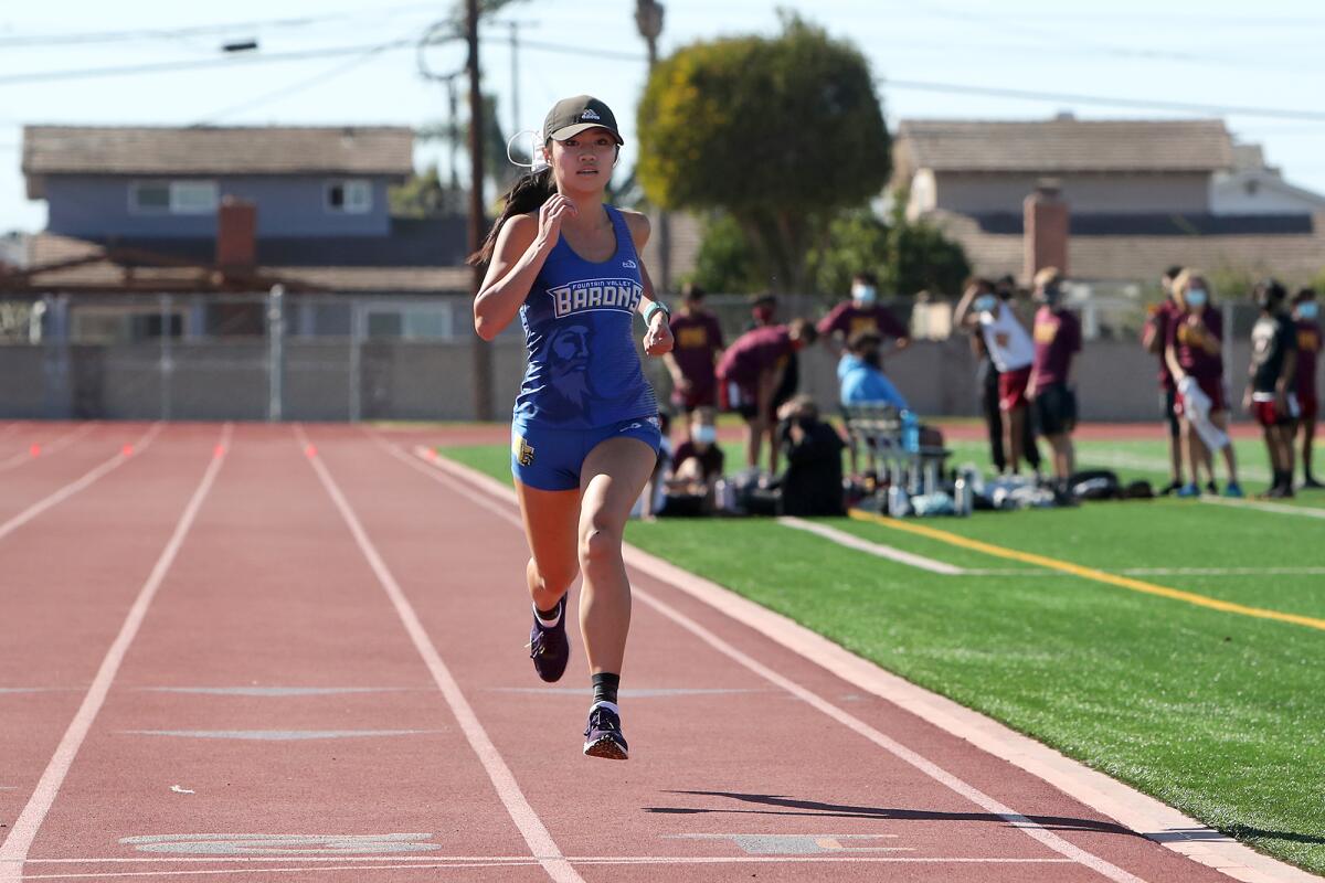 Fountain Valley's Kaho Cichon is first to the finish line against Ocean View in a cross-country dual meet.