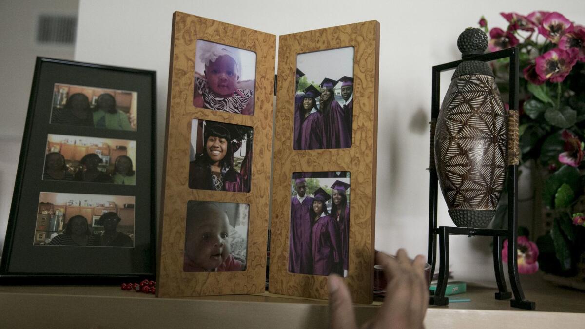 Framed photos of Cassaundra in the family's living room.