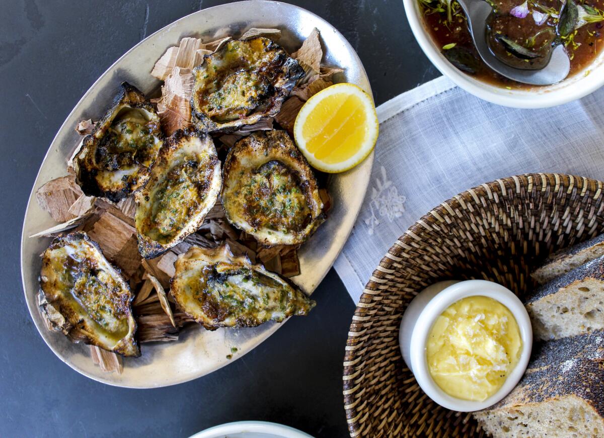 An overhead photo of hearth-grilled oysters from new restaurant Dunsmoor.