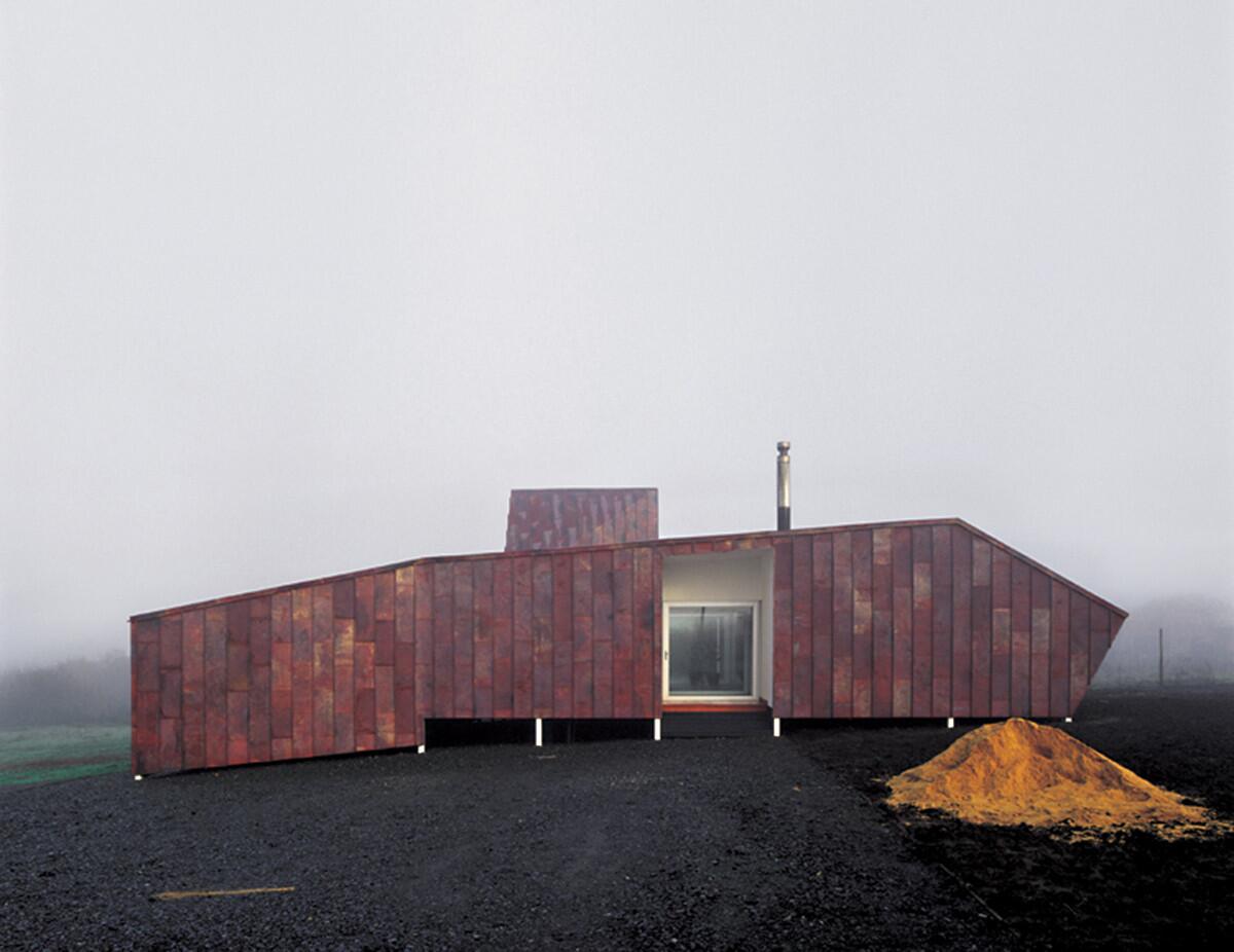 Radic's Copper House 2, outside of the city of Talca, has a sloping roof line inspired by the sagging roofs that the architect saw in country homes in the area.