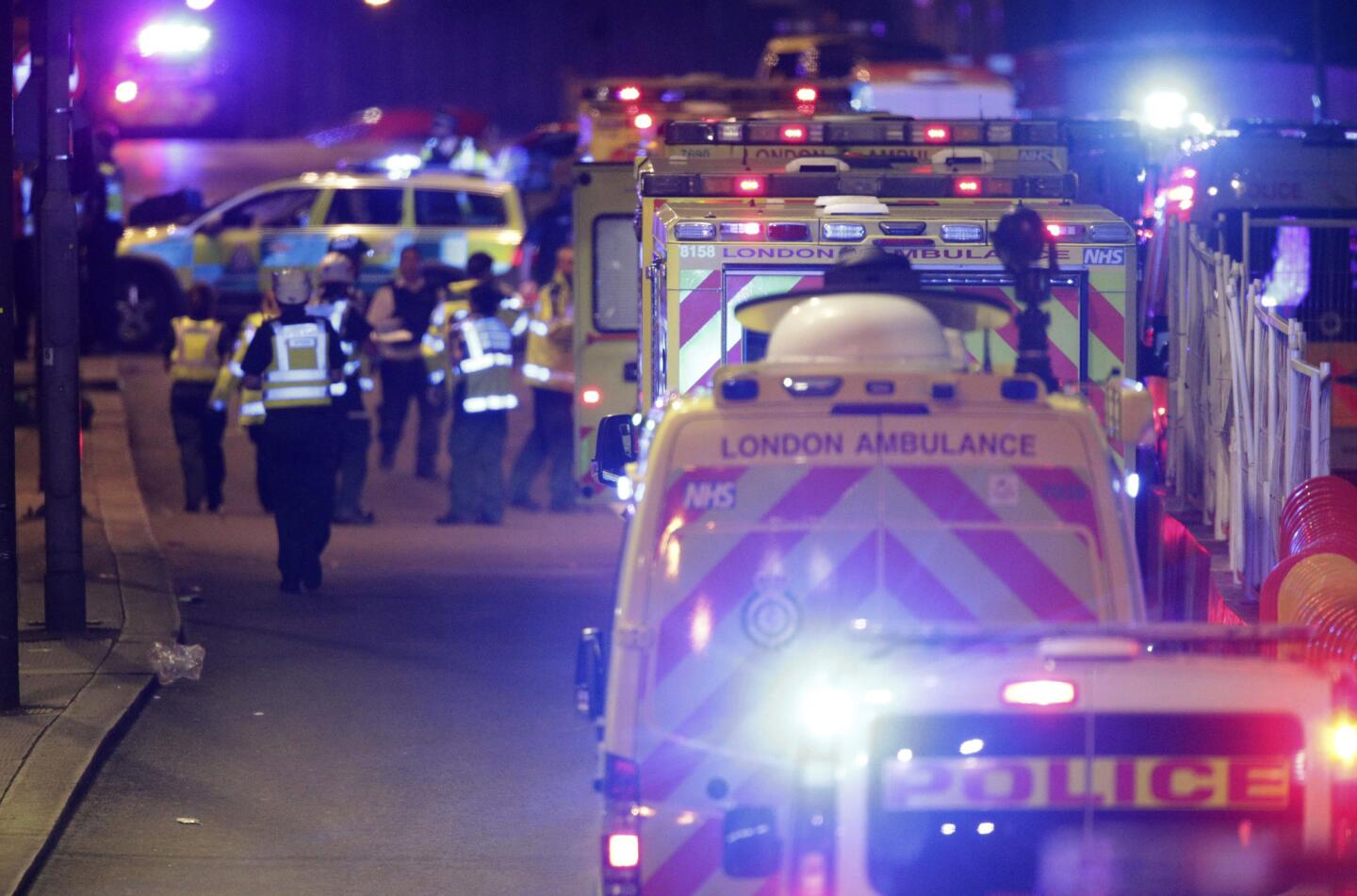 Emergency crews tend to the injured on London Bridge after the attack.