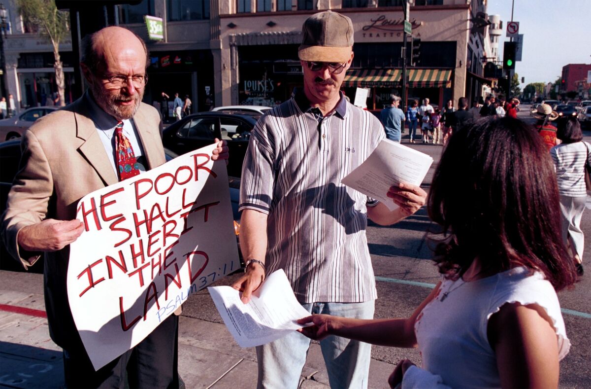 Glenn Stassen, left, and Mark Harlan, a teacher and a student at the Fuller Theological Seminary, show their support for the Palestinians during a march in Pasadena in 2002.