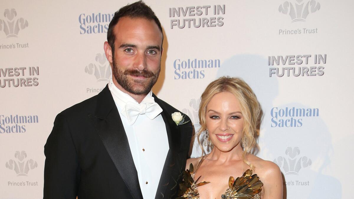 Kylie Minogue and boyfriend Joshua Sasse are reportedly engaged. Here, they attend a pre-dinner reception for the Prince's Trust Invest in Futures Gala in London on Feb. 4.