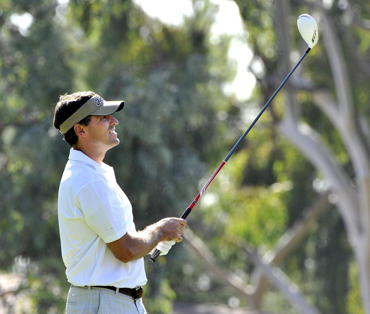 Palm Crest father Todd Reynolda, of La Canada, tees off on the second and watches his shot at La Canada Flintridge Country Club in La Canada Flintridge where the Palm Crest Elementary School PTA's Dad's Committee hosts a golf tournament on Monday, October 21, 2013.