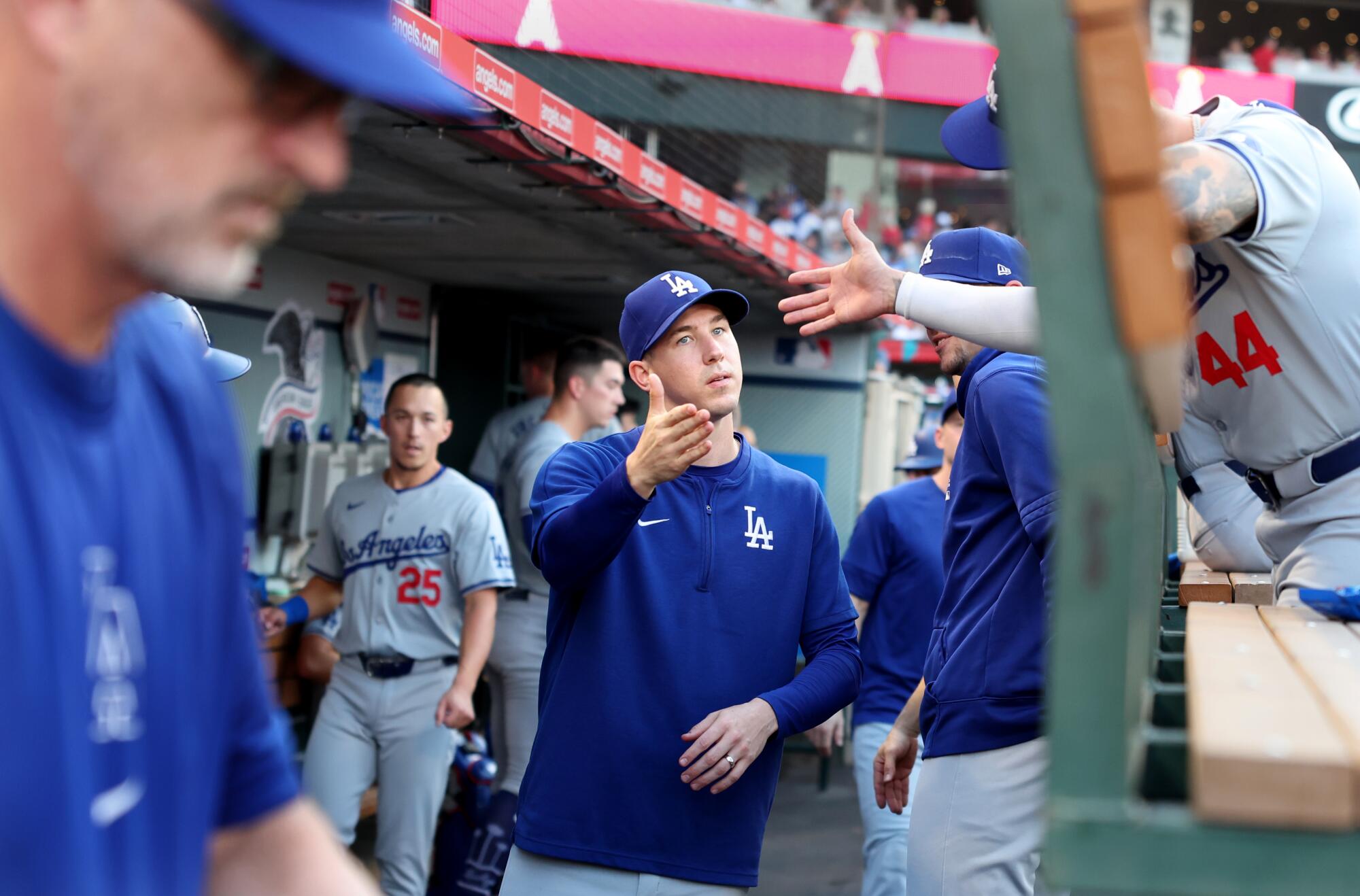 Dodgers pitcher Walker Buehler greets teammates before a game against the Angels in Anaheim.