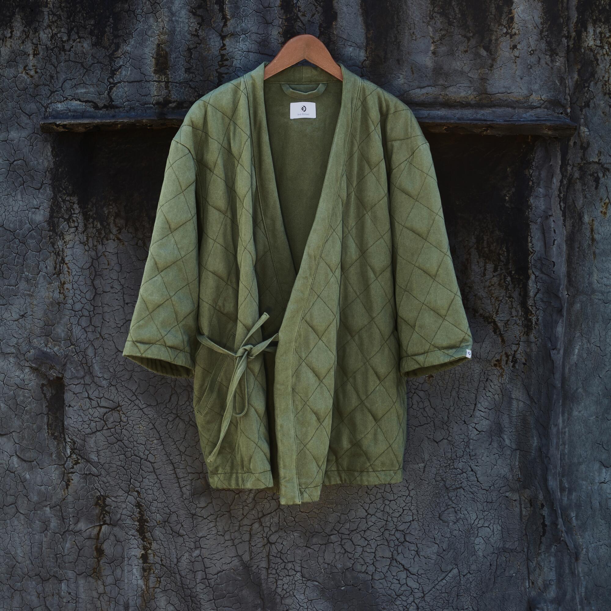 A sage green wrap jacket