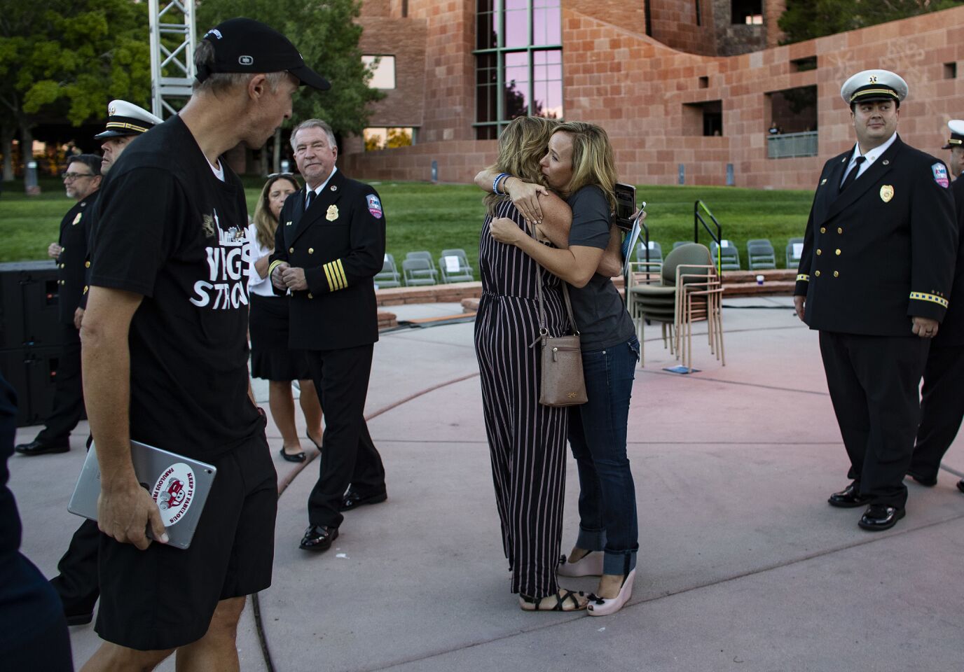 Mynda Smith, right, hugs Mary Jo Von Tillow after the sunrise remembrance. Smith's sister Neysa Tonks and Von Tillow's husband, Kurt, were killed in the Las Vegas shooting.