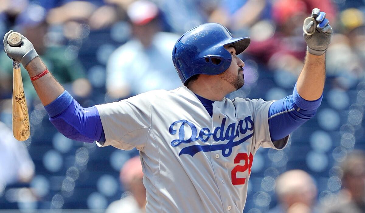 Adrian Gonzalez hits a home run Saturday against Washington in the sixth inning of a game that was suspended on Friday night.