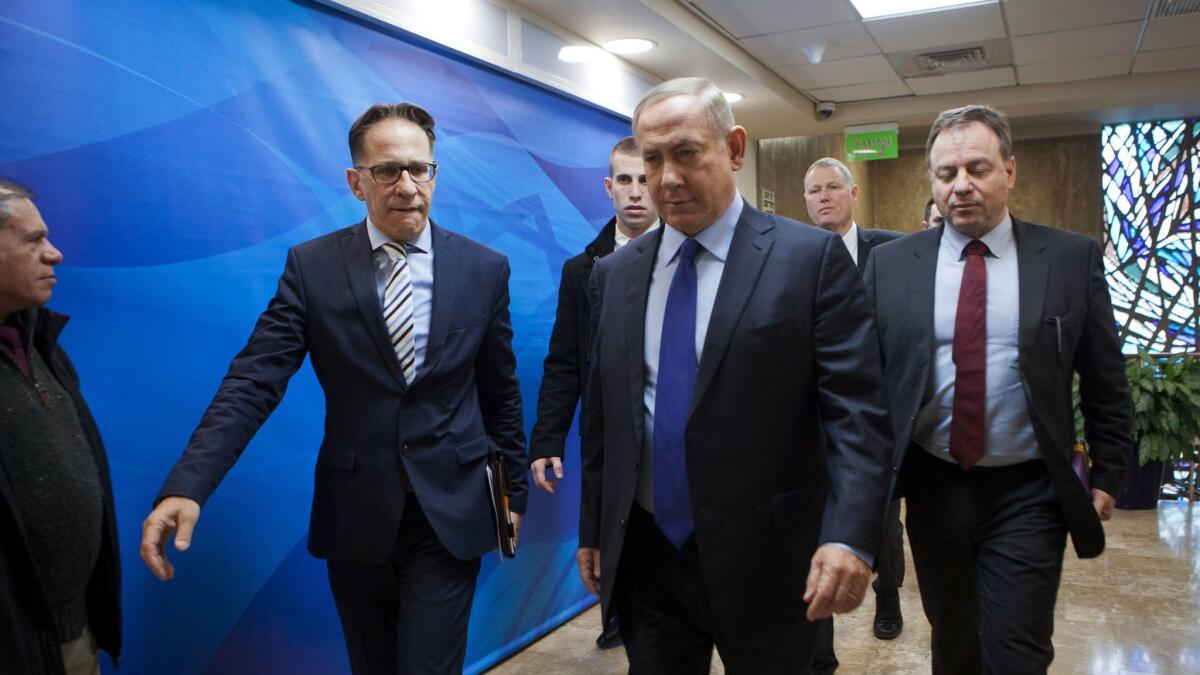 Israeli Prime Minister Benjamin Netanyahu, second right, arrives for a weekly Cabinet meeting in Jerusalem on Dec. 25, 2016.