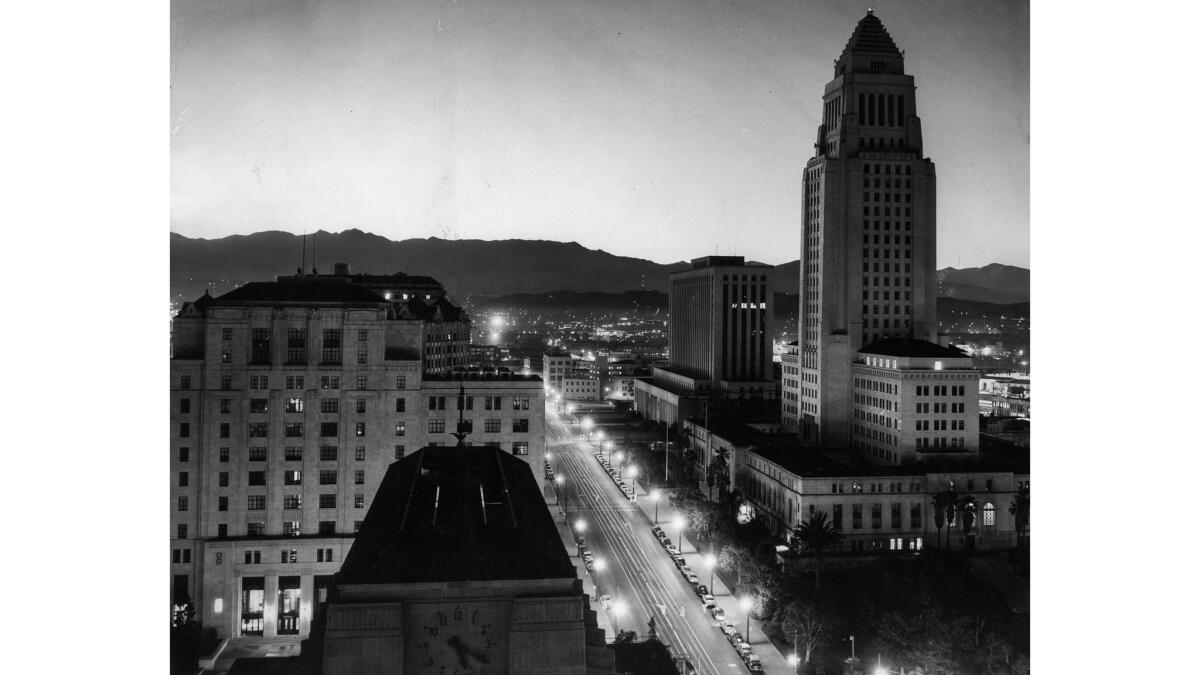 March 7, 1955: Los Angeles City Hall at 5:20 a.m. with the sky lightened by an A-bomb test in Nevada. The real dawn was 20 minutes later.
