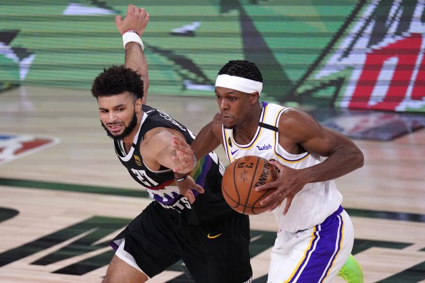 Denver Nuggets' Jamal Murray (27) has the ball stripped away by Los Angeles Lakers guard Rajon Rondo, right, during the second half of Game 3 of the NBA basketball Western Conference final Tuesday, Sept. 22, 2020, in Lake Buena Vista, Fla. (AP Photo/Mark J. Terrill)