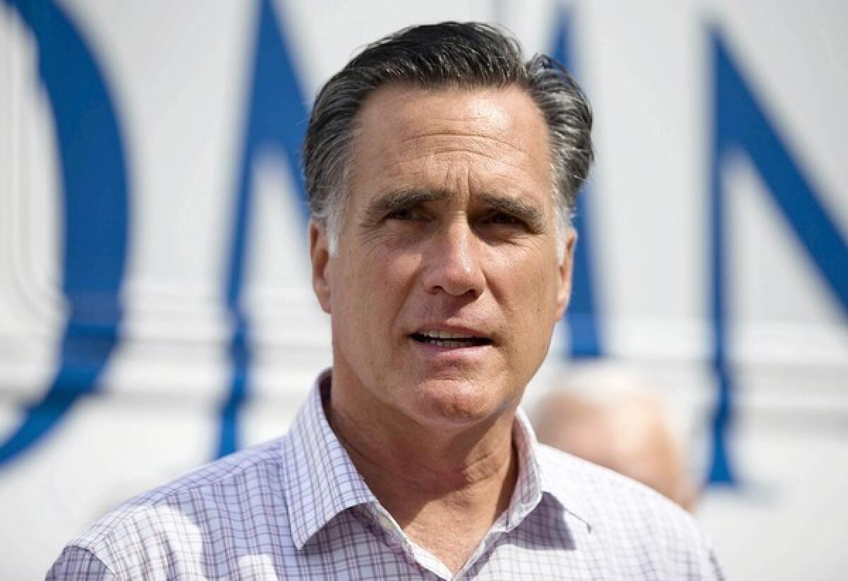 Mitt Romney, seen here at a campaign stop in New Hampshire, has received sharp criticism for his comments belittling President Obama's supporters.