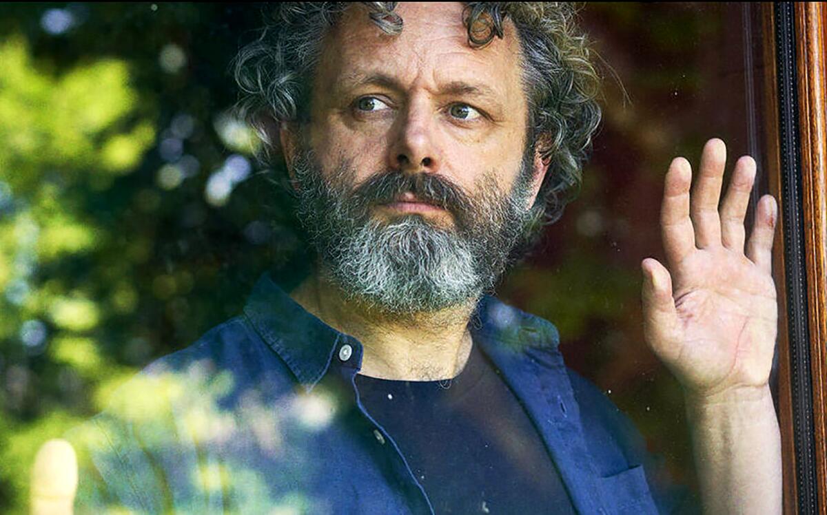 Michael Sheen looks out a window in "Staged."