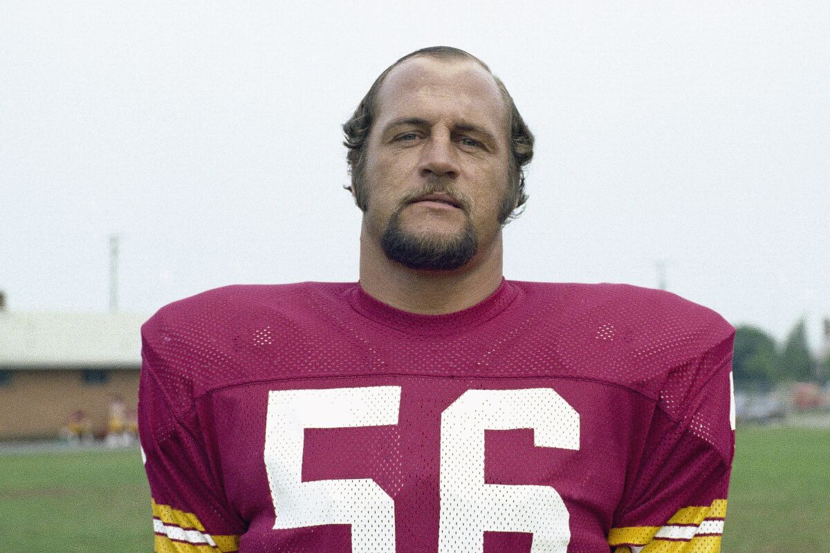 FILE - Len Hauss, center for the Washington Redskins is shown in 1975. Hauss, a five-time Pro Bowl center for Washington who started every game over the last 13 seasons of his 14-year NFL career, has died. He was 79. His daughter, Lana Hauss Snyder, said in a telephone interview Thursday that Hauss died Wednesday, Dec. 15, 2021, at Wayne Memorial Hospital in Jesup, Georgia, after an extended illness. (AP Photo/File)
