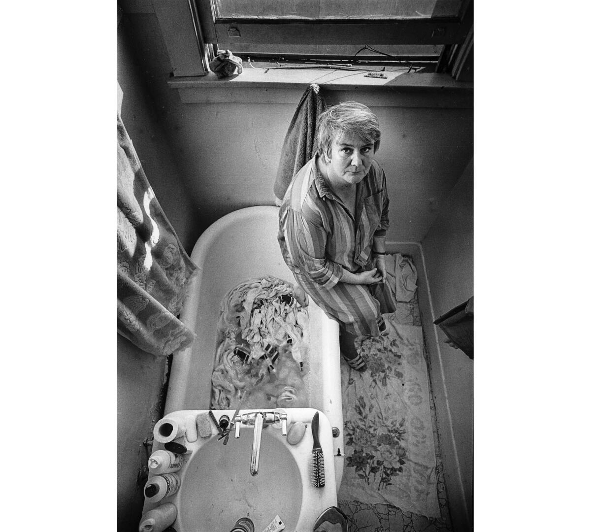Jan. 12, 1987: Kate Livingston, 46, lives in a San Pedro homeless shelter. She does her laundry in the bathtub.