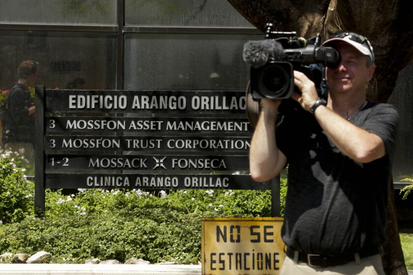 A cameraman films outside the Arango Orillac Building--which lists the Mossack Fonseca law firm as a tenant--in Panama City, Panama, on April 5.
