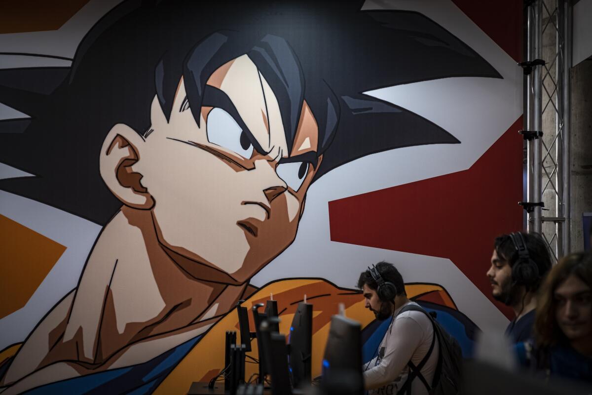 a mural of Goku from Dragon Ball at a gaming festival 