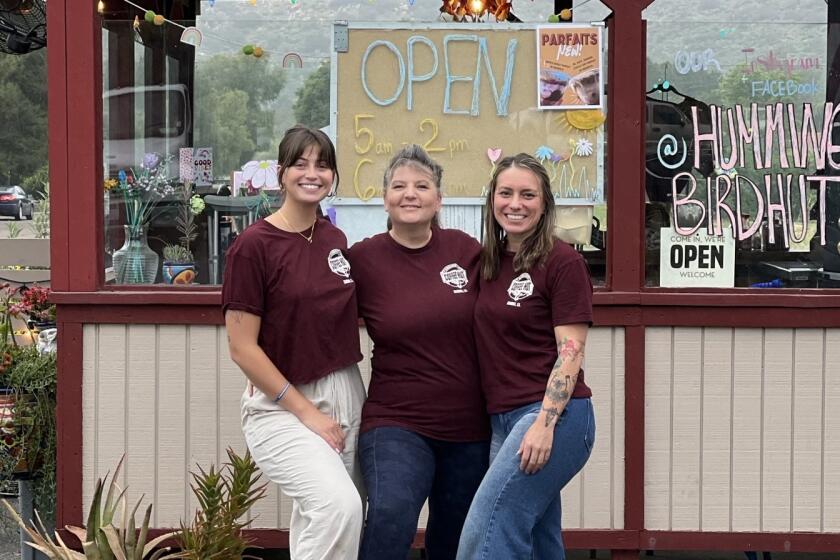 Staff members serving coffee at Hummingbird Coffee Hut are, from left, Taylor Bloom, Jacci Sher and Ronna Schacht.