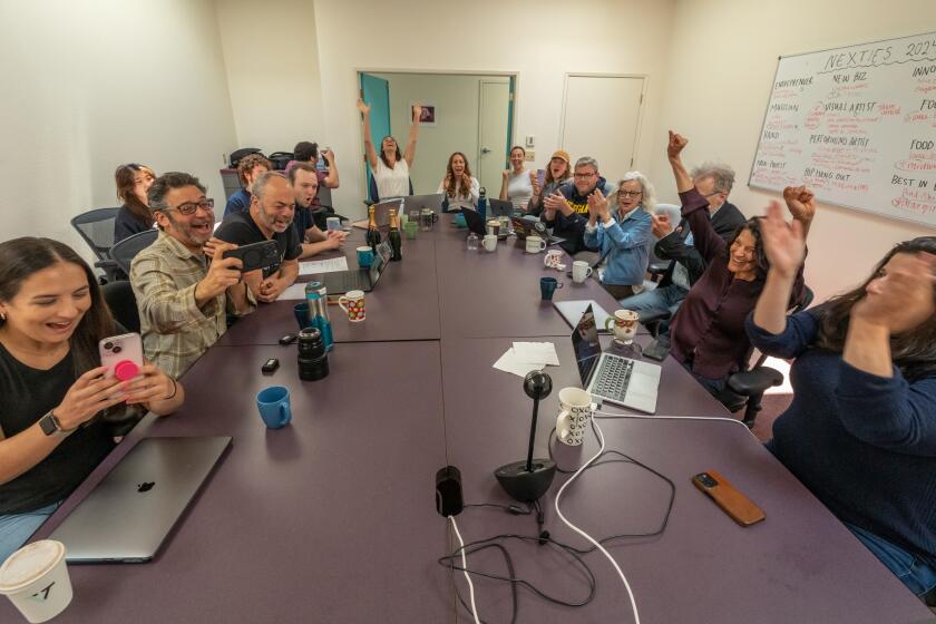 Staff at the online Lookout Santa Cruz react after winning the Pulitzer Prize.