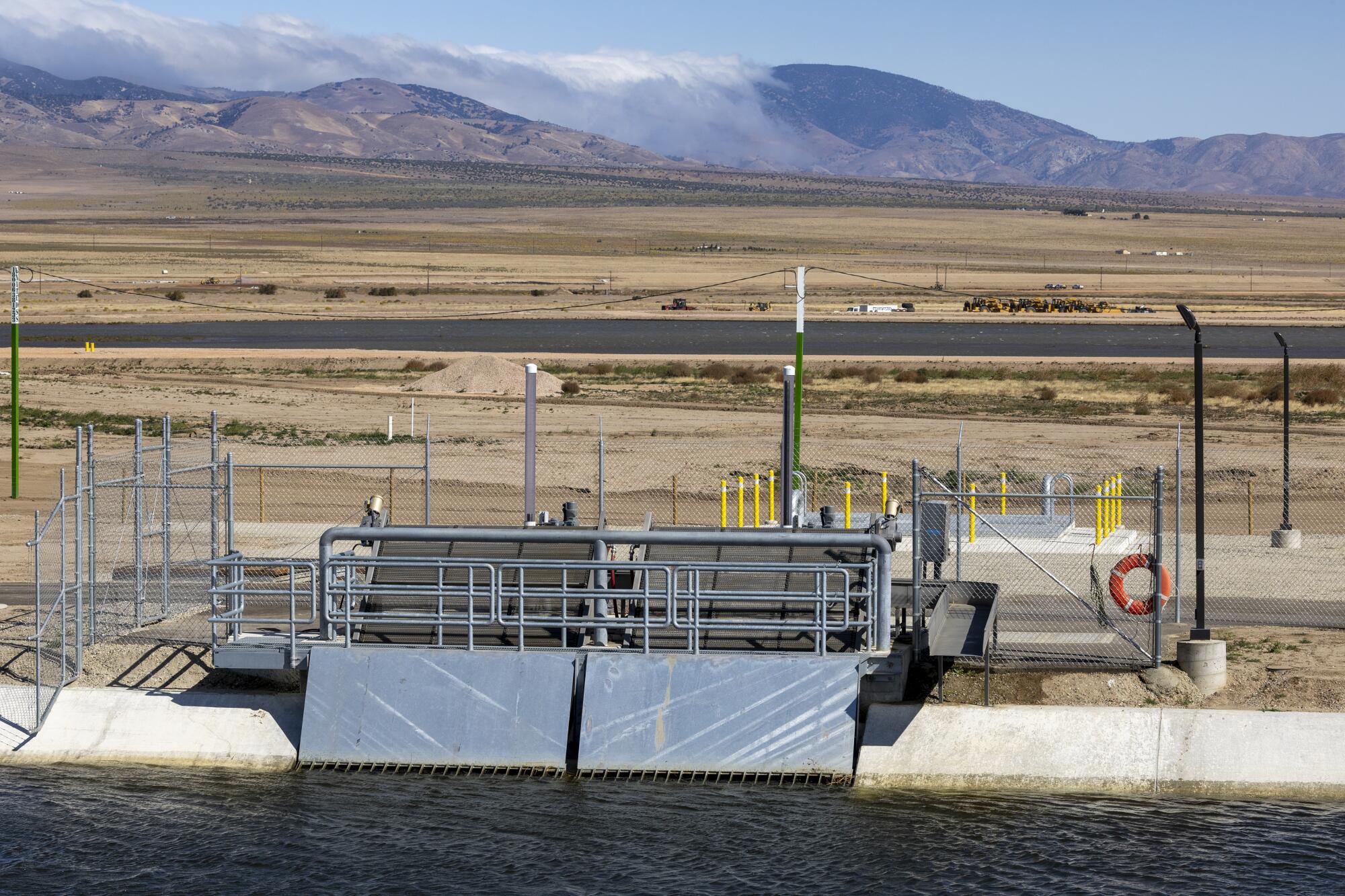 At a turnout facility on the California Aqueduct, water flows into the newly built High Desert Water Bank.