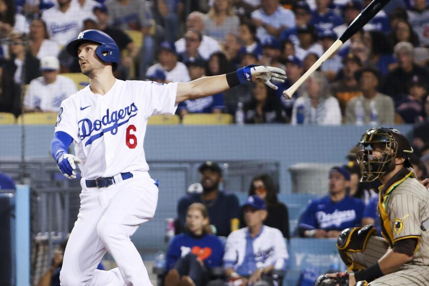 Los Angeles, CA - October 11: Los Angeles Dodgers' Trea Turner tosses his bat after hitting a solo home run during the first inning of game one of the NLDS against the San Diego Padres at Dodger Stadium on Tuesday, Oct. 11, 2022 in Los Angeles, CA.(Robert Gauthier / Los Angeles Times)