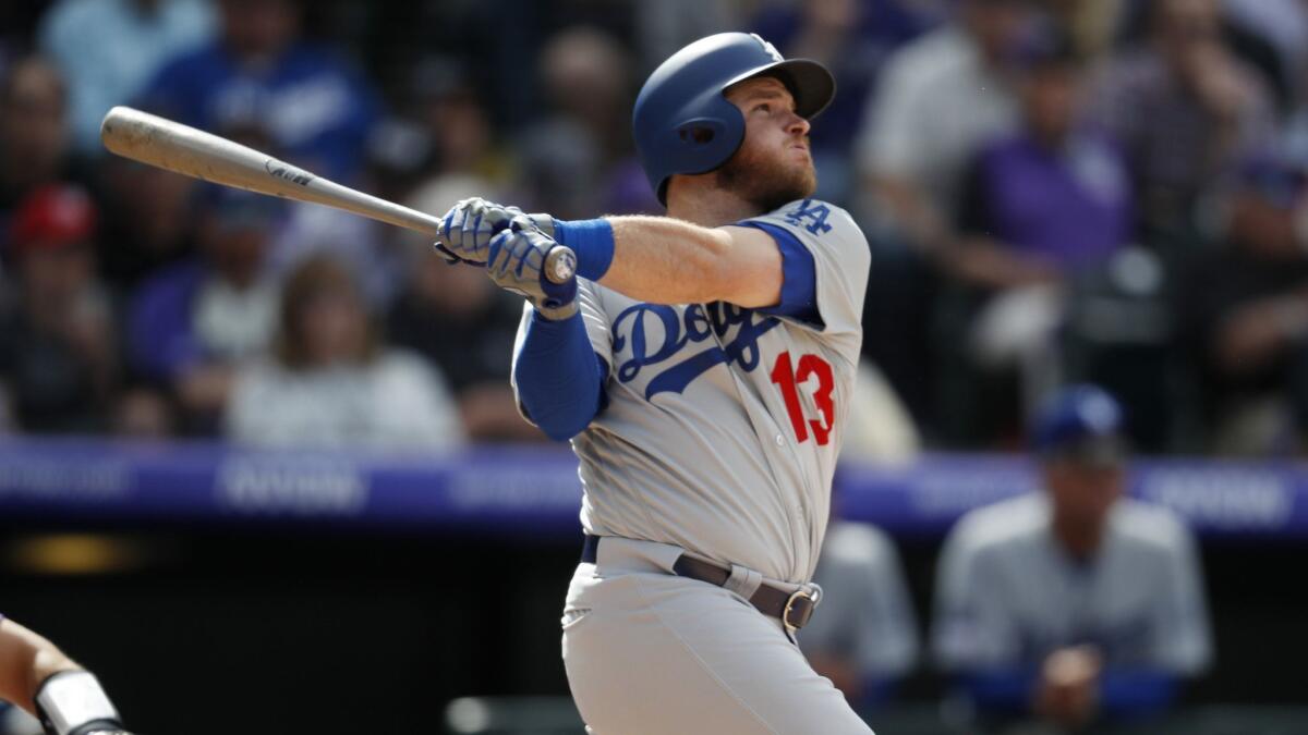 Dodgers first baseman Max Muncy follows through on a solo home run in the fourth inning of a 10-6 victory over the Colorado Rockies on Friday.