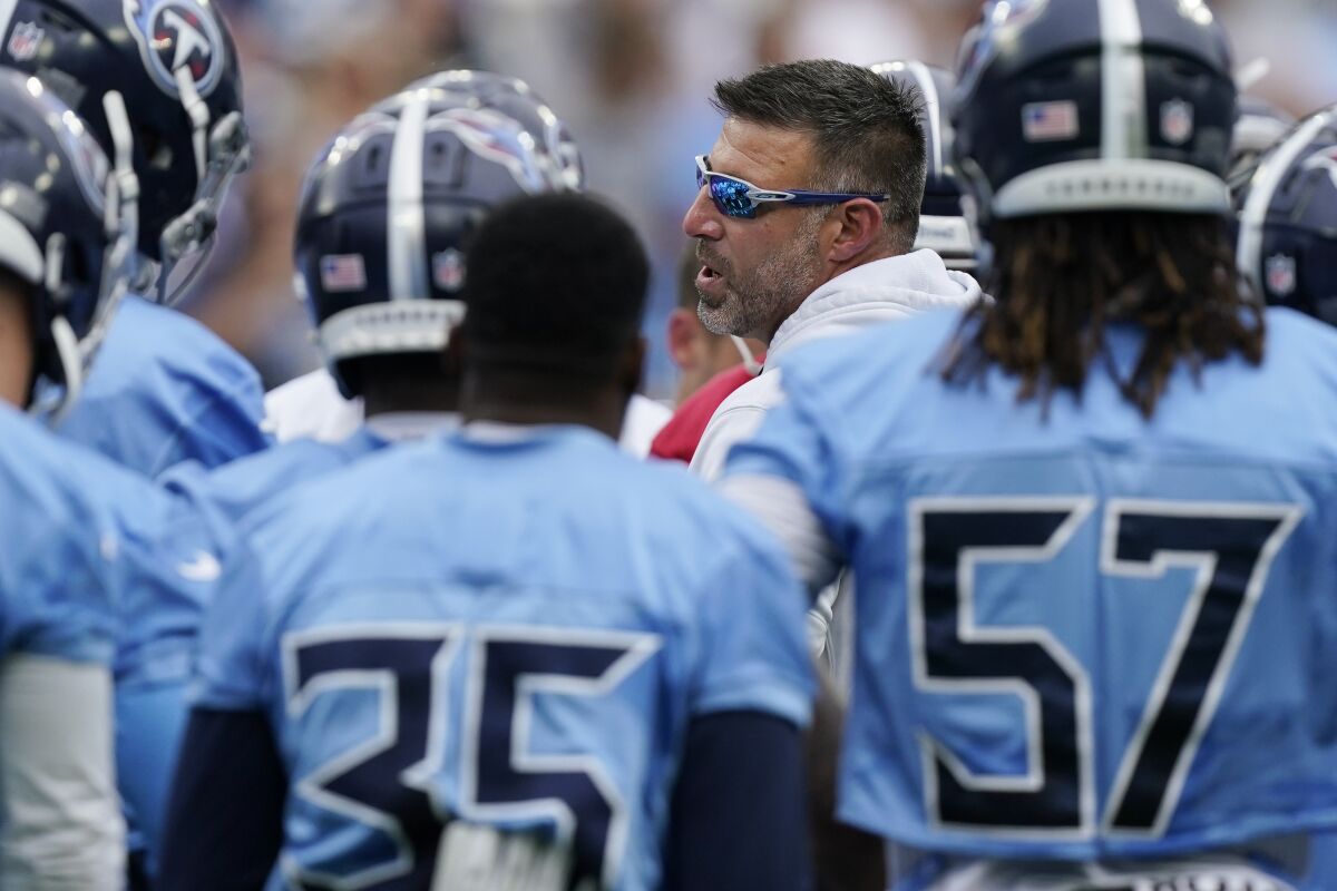 Tennessee Titans head coach Mike Vrabel talks to his players during NFL football training camp Monday, Aug. 16, 2021, in Nashville, Tenn. (AP Photo/Mark Humphrey)