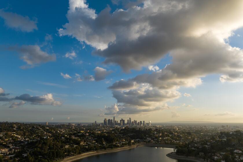 LOS ANGELES, CA - DECEMBER 06: Clouds move through Los Angeles, as seen from the Silver Lake Reservoir, bringing a chance of evening rain. Photographed on Tuesday, Dec. 6, 2022 in Los Angeles, CA. (Myung J. Chun / Los Angeles Times)