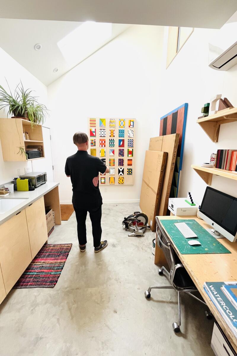 Designer Ben Warwas stands inside the 250-square foot ADU.