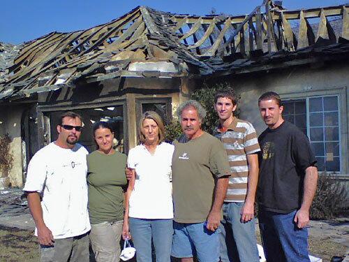 The Kunzes thought their Fallbrook house was fireproof, built with a steel frame instead of wood and with plaster three times the normal thickness. They stand in front of what's left of it: from left, son-in-law Jeremiah Boshard, daughter Jaime, mother Shari, father Glenn and sons Daniel and David.