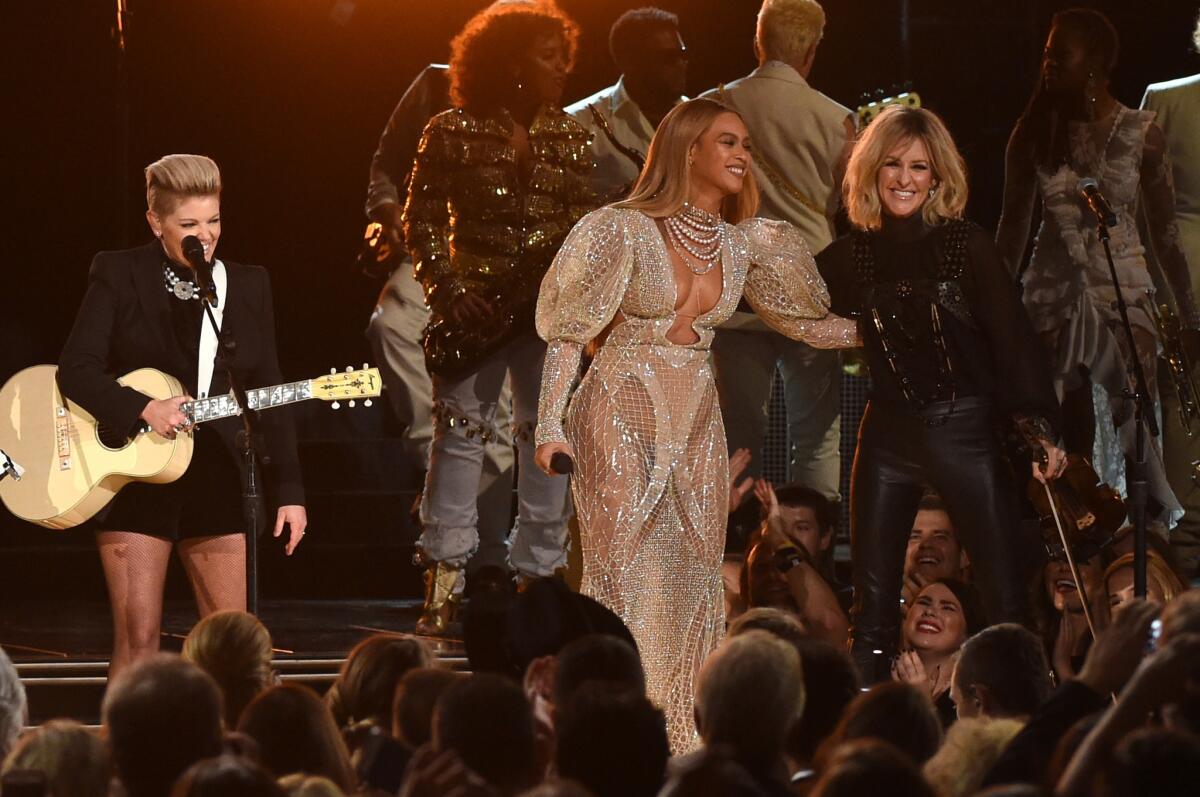 Beyoncé performs with Natalie Maines, left, and Martie Maguire of the Dixie Chicks at Wednesday's CMA Awards.