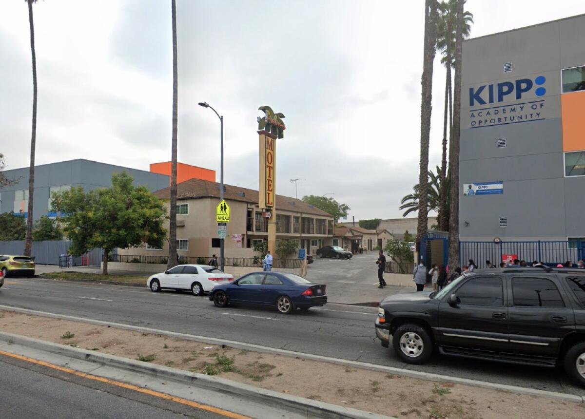 Palms Motel stands between two schools.