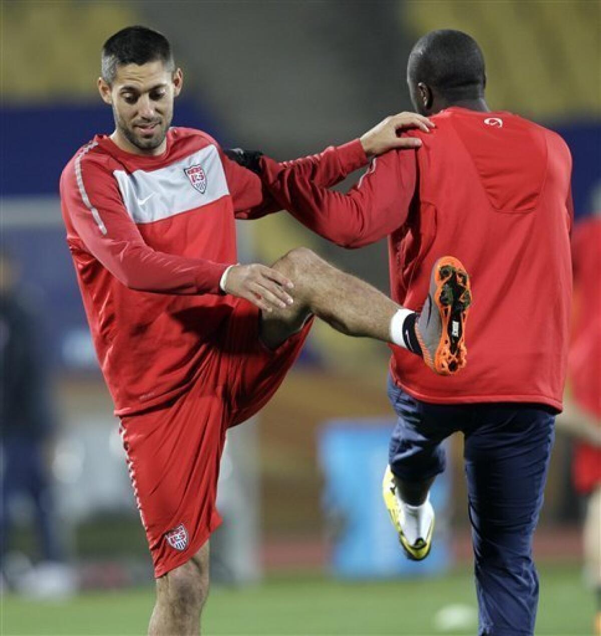 U.S. national soccer players Clint Dempsey, left, and Jozy Altidore, stretch during training at Royal Bafokeng Stadium in Rustenburg, South Africa Friday, June 11, 2010. The U.S. will play England in a soccer World Cup Group C match on Saturday. (AP Photo/Elise Amendola)