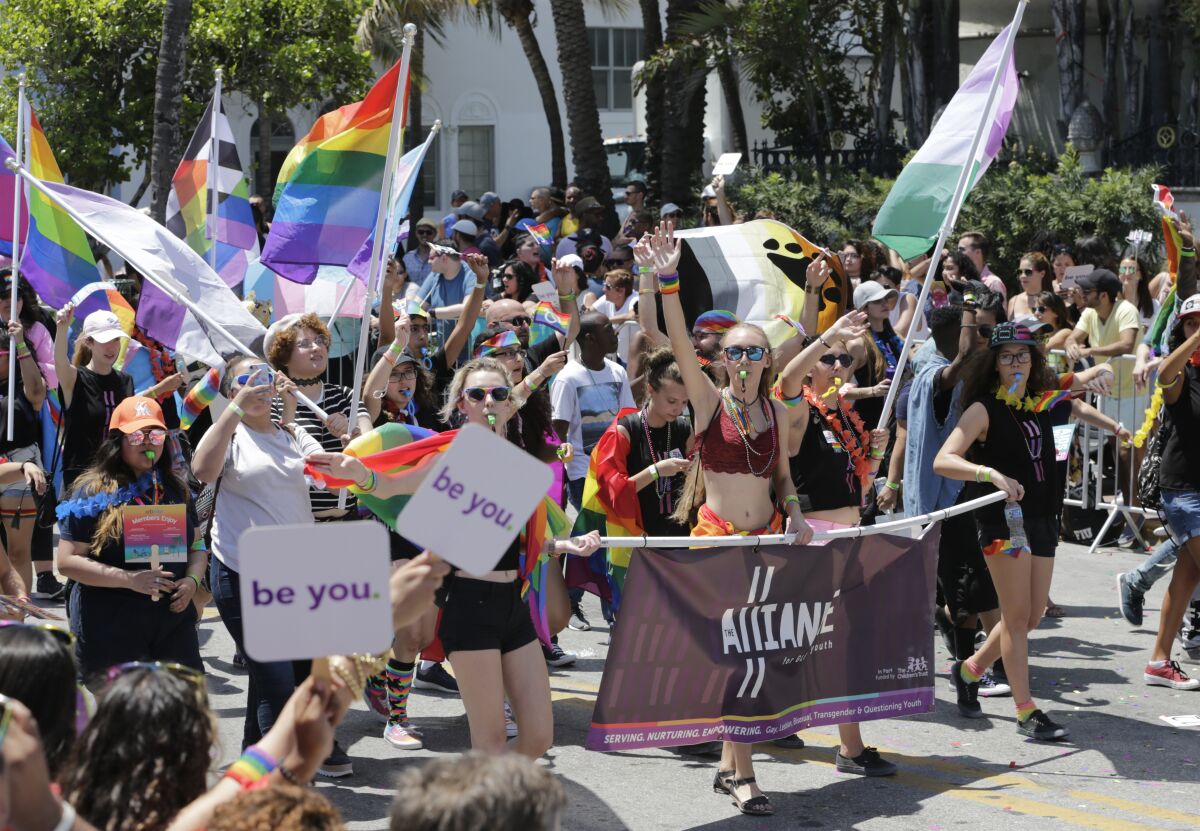Participants with the Alliance for GLBTQ Youth march at the annual Miami Beach Gay Pride Parade