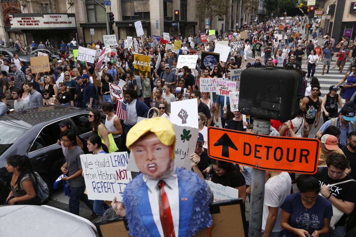 Protesters march along 3rd Street in downtown Los Angeles.