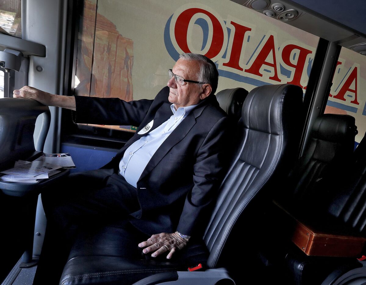 FILE - In this Aug. 23, 2018, file photo, U.S. Senate candidate and former Maricopa County Sheriff Joe Arpaio rides on his campaign bus in Phoenix. Arpaio's primary defeat in his bid to win back the sheriff's post in metro Phoenix marks what's likely to be the 88-year-old's last political campaign. (AP Photo/Matt York, File)