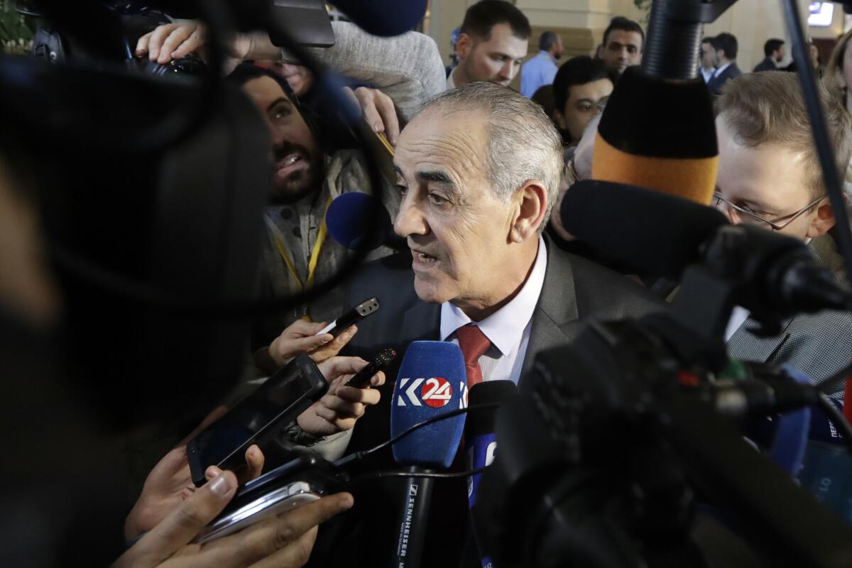 Syrian opposition spokesman Yahya Aridi speaks to the news media as he arrives to attend peace talks in Astana, Kazakhstan, on Jan. 24.