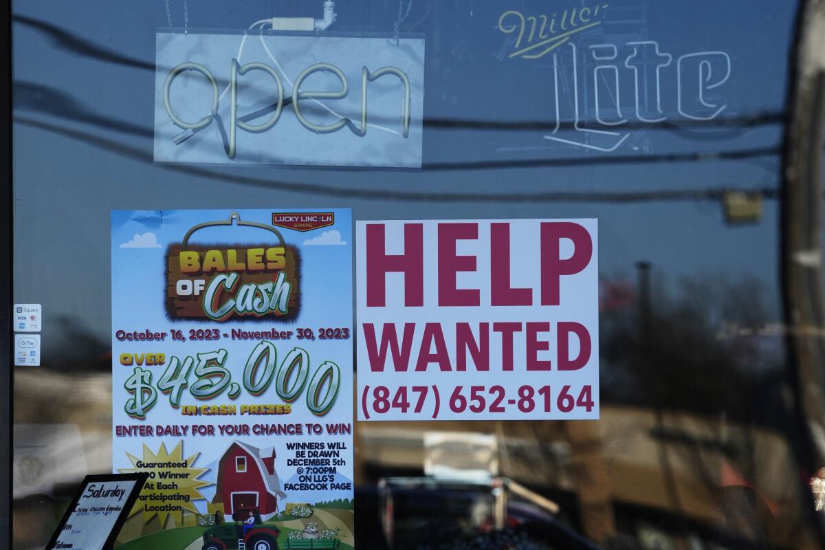 A "Help Wanted" sign is displayed at a restaurant in Buffalo Grove, Ill., Thursday, Jan. 18, 2024.