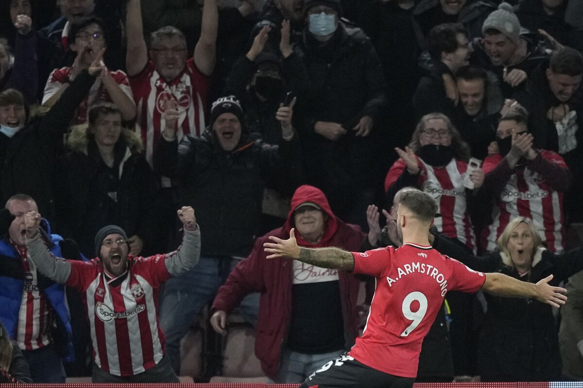 Southampton's Adam Armstrong celebrates after scoring his side's opening goal during the English Premier League soccer match between Southampton and Aston Villa at the Saint Mary's Stadium in Southampton, England, Friday, Nov. 5, 2021. (AP Photo/Frank Augstein)