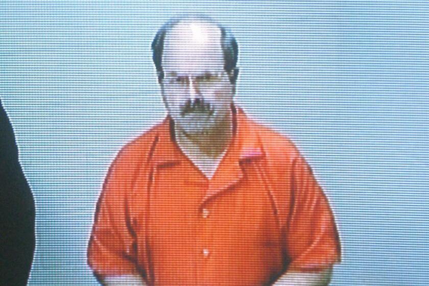 Dennis Rader, the BTK killer, during an arraignment in 2005, is working on a book about the murders.