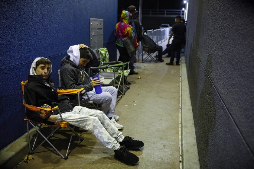 Two customers line up before dawn at the Best Buy store in Mission Valley on Black Friday. 